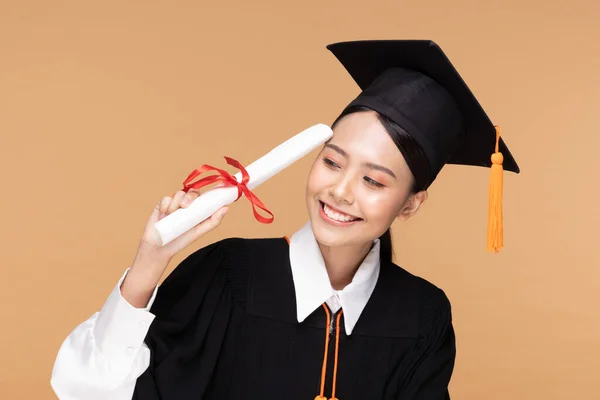Happy Graduate Asian Woman Cap Gowm Holding Certificated Diploma Beige — Stok Foto