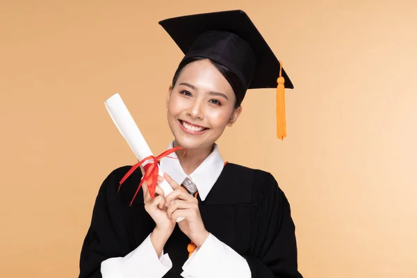 Happy Graduate Asian Woman Cap Gowm Holding Certificated Diploma Beige — Stock Photo, Image