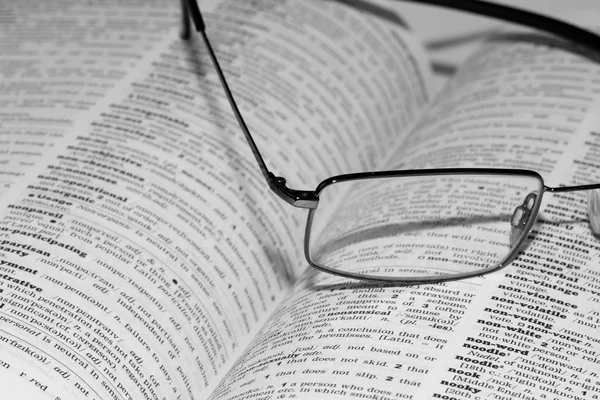 Spectacles on open book — Stock Photo, Image