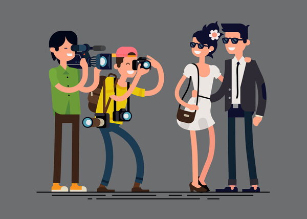 Photographer and videographer professionals at work 