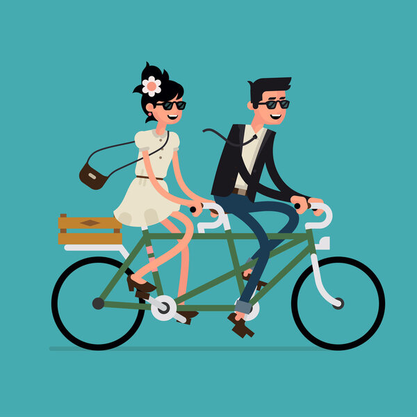 couple riding tandem bicycle