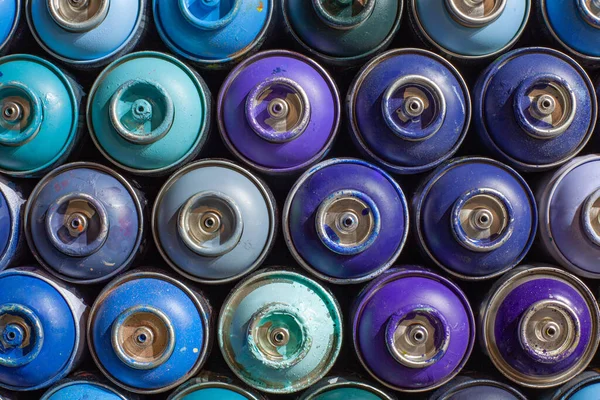 Many empty cylinders of paint for graffiti. Tools for street art — Stock Photo, Image