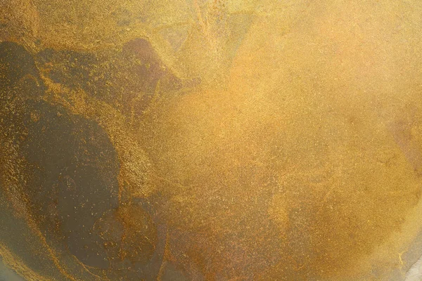 Parlak boya lekelerinin altın grunge arka planı.