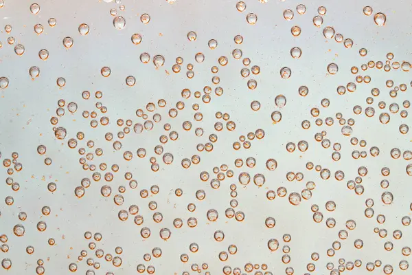 Buborékok Levegő Üveg Fényes Arany Részecskék Háttér Kis Buborékok — Stock Fotó