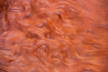 Turuncu soyut arkaplan, parlak metalik boya ve dalgaların içinde boya.