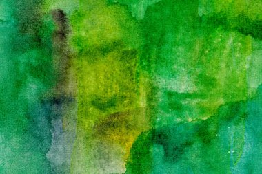 Kağıt yeşil arkaplanda suluboya deseni farklı renklerde boya darbeleriyle