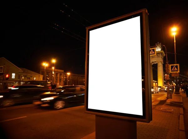 Billboard on the street glows at night. Layout for advertising design. Outdoor Digital display pylon with a white field.