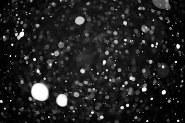 Siyah arkaplanda Soyut Arkaplan Defocus Işık Noktaları.