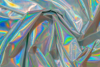 Yanardöner kumaş modayı holografik arka plan. Renkli krom kumaş.