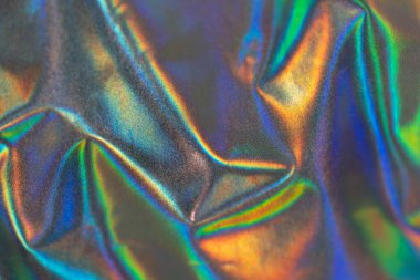 Yanardöner kumaş kumaş, modaya uygun holografik arka plan. Renkli krom kumaş.