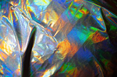 Yanardöner kumaş holografik arka plan. Buruşmuş yüzey folyosu