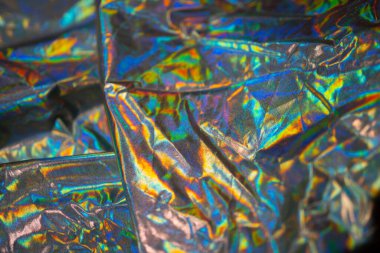 Yanardöner kumaş holografik arka plan. Buruşmuş folyo yüzeyi