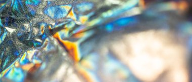 Yanardöner kumaş holografik arka plan. Buruşmuş folyo yüzeyi