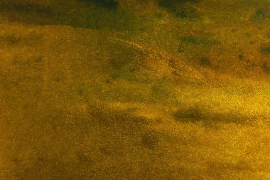 Koyu sarı arka plan suluboya kağıt üzerinde düz olmayan lekeler