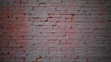 Mercan tonlarıyla boyanmış duvar tuğlası. Ortası aydınlık.