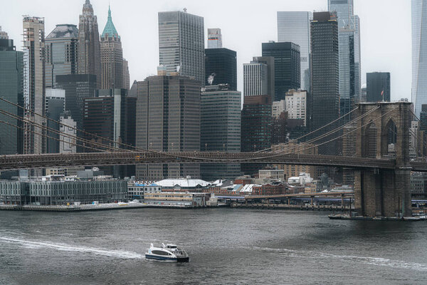 New York City, New York USA - February 11 2021: New York. View from the Dumbo Brooklyn on Manhattan skyline. Dumbo. New York landmark Brooklyn Bridge.