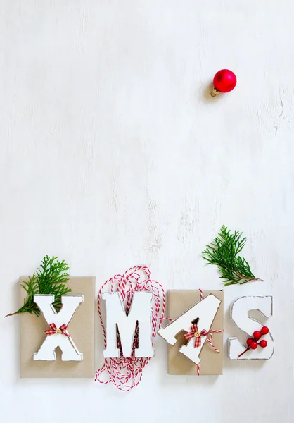 Palabra de Navidad sobre un fondo de madera — Foto de Stock