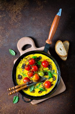 Omelet or frittata with tomatoes clipart