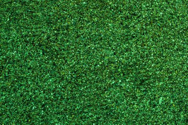 Küçük boncuklardan yapılmış parlak yeşil bir arkaplan