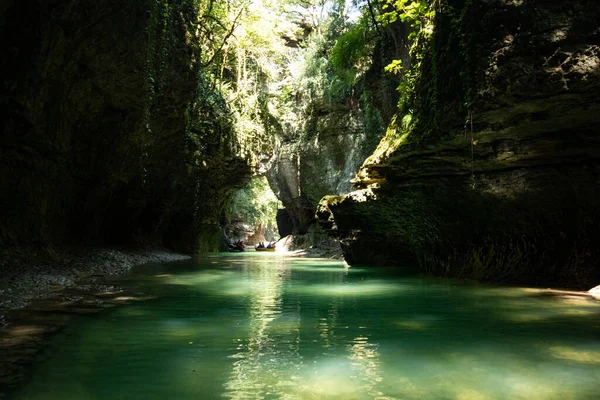 canyon with blue water and white rocks