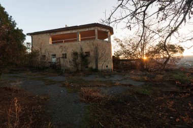 abandoned building with mountain views