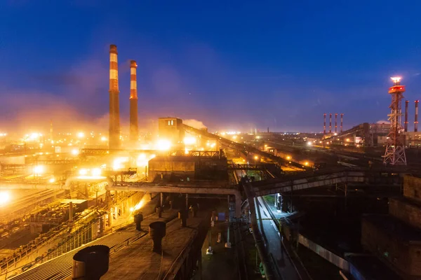 factory worker lights at night