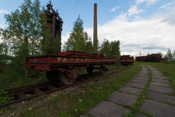 red trolley with a container on rails