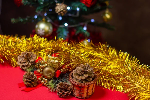 Christmas concept. Christmas cones on the background of the Christmas tree. Christmas decorations