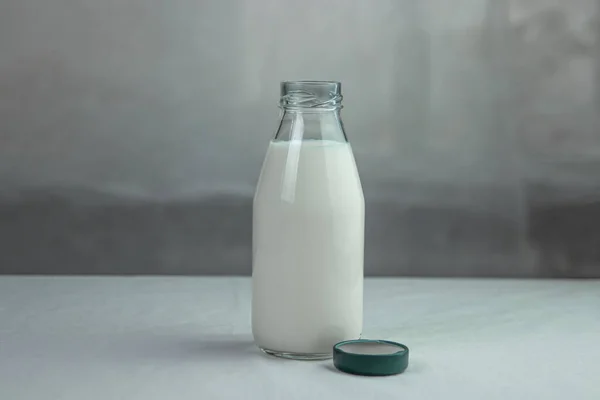Milk in a glass bottle. Isolated milk on the table. Milk product.
