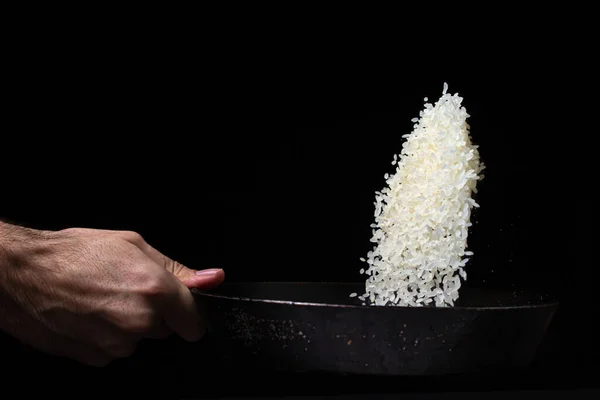 Toss Rice Skillet Cook Throwing Rice Black Background Cooking Photo — Foto de Stock