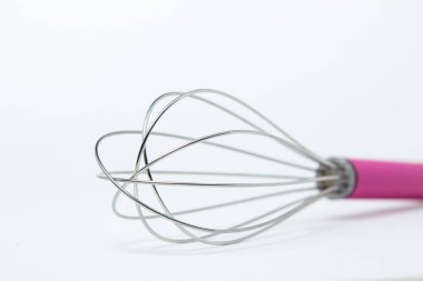 Steel whisk on a white background. Kitchen tool. Whipping tool