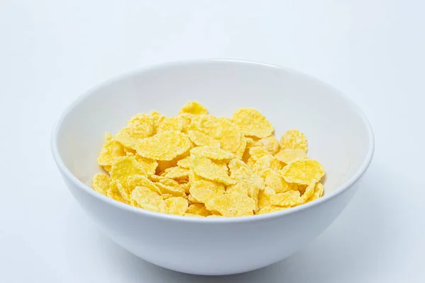 Piring Dengan Cornflakes Pada Latar Belakang Putih Sehat Dan Lezat — Stok Foto