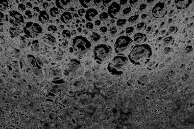 Soyut arkaplan. Monokrom dokusu. Görüntü, siyah ve beyaz tonun etkilerini de içeriyor. Kasılma ve kurutma efektleri çatlatır