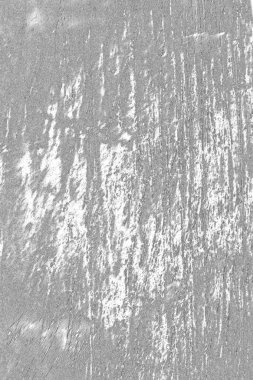 Çizik ve çatlaklarla dolu gri bir doku.