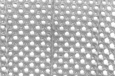 Çizik ve çatlaklarla dolu gri bir doku.