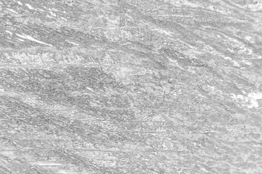 Çizik ve çatlaklarla bembeyaz bir doku.