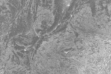 Çizik ve çatlaklarla dolu pis bir doku.