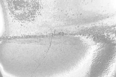 Çizik ve çatlaklarla bembeyaz bir doku.