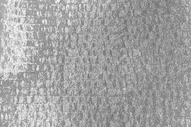 Çizik ve çatlaklarla dolu pis bir doku.