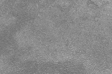 Çizik ve çatlaklarla dolu gri bir doku.