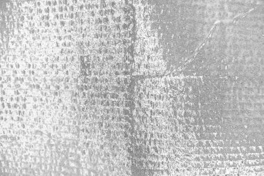 Çizik ve çatlaklarla dolu pis bir doku.