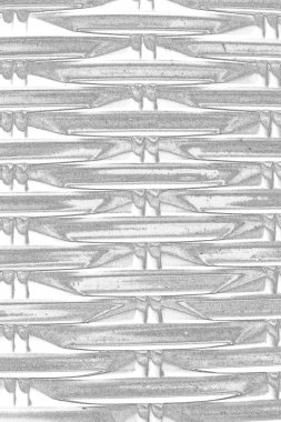 Çizik ve çatlaklarla bembeyaz bir doku.