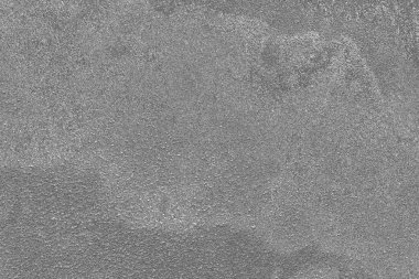 Çizik ve çatlaklarla dolu gri bir doku.