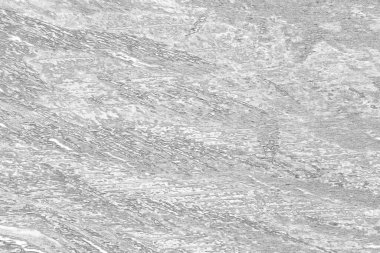 Çizik ve çatlaklarla bembeyaz bir doku.