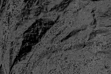 Çizik ve çatlaklarla dolu pis bir doku.