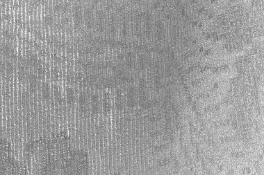 Çizik ve çatlaklarla bembeyaz bir doku.