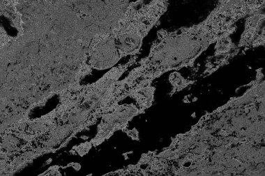 Çizik ve çatlaklarla dolu pis bir doku.