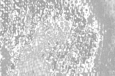 Çizik ve çatlaklarla bembeyaz bir doku.