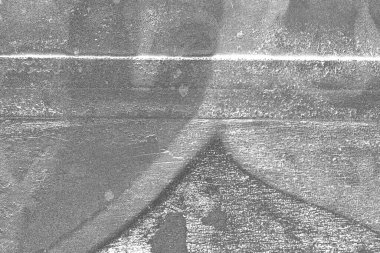 Çizik ve çatlaklarla dolu gri bir doku.