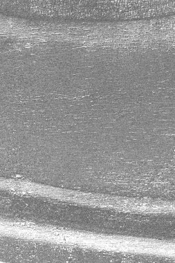 Çizik ve çatlaklarla dolu gri bir doku.